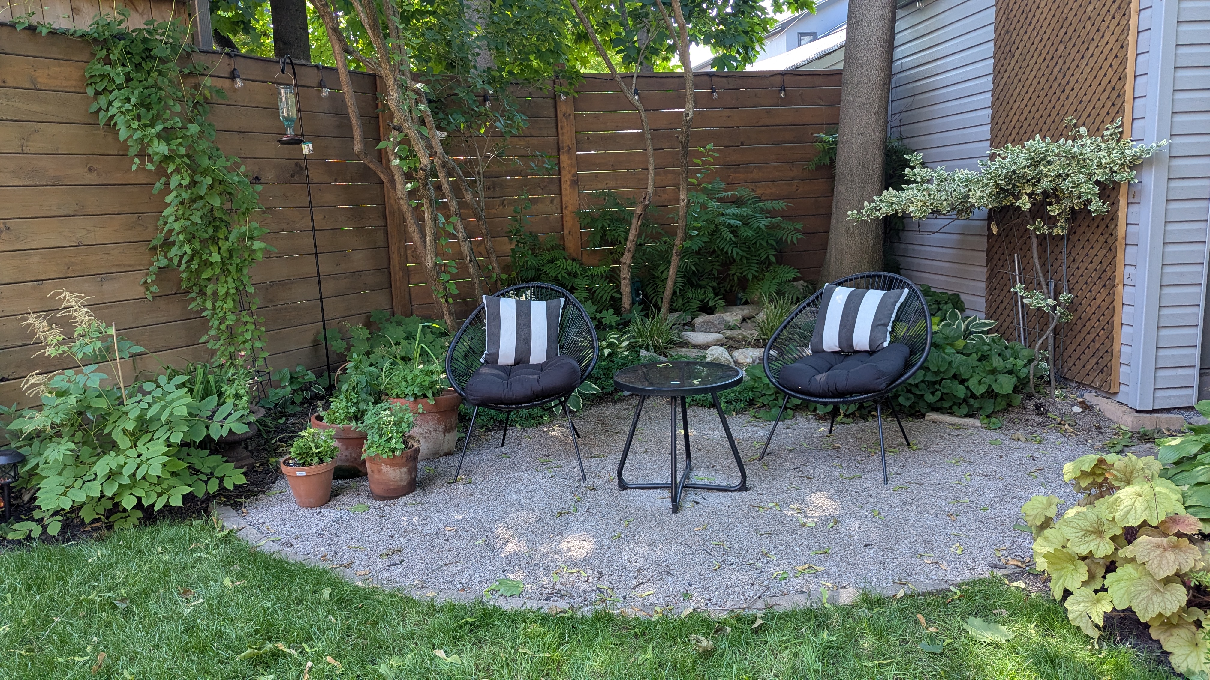 After: gravel seating area with chairs